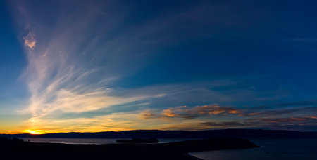 Panorama of the cape and the island of Kharantsi on the alkhon at sunset.の写真素材