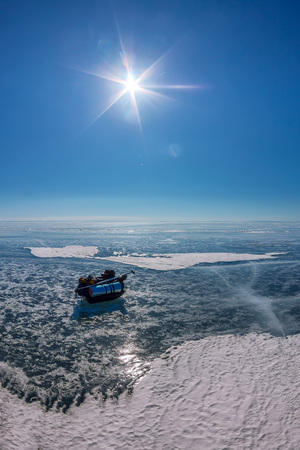 tourist ice sled on the blue ice of Baikal.の写真素材