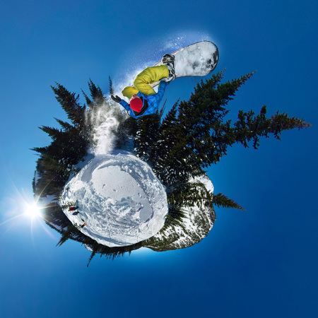 Snowboarder freerider jumping from snow ramp. Spherical 360 panorama little planet.の写真素材