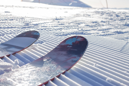 The tips of the skis on the fresh Velvet ski slopes. Alpine skiing freeride in Rosa Khutorの写真素材