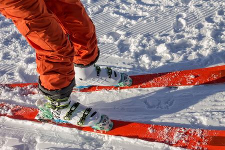 Legs of a skier freerider close up stand on a velvete trackの写真素材