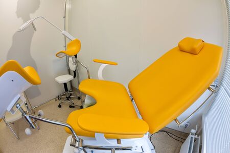 Interior gynecological office with an orange chair in a medical clinic.の写真素材
