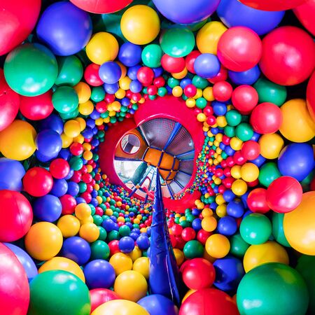childrens playroom with colorful balls and a slide made of plastic. . Tiny little planet 360の写真素材