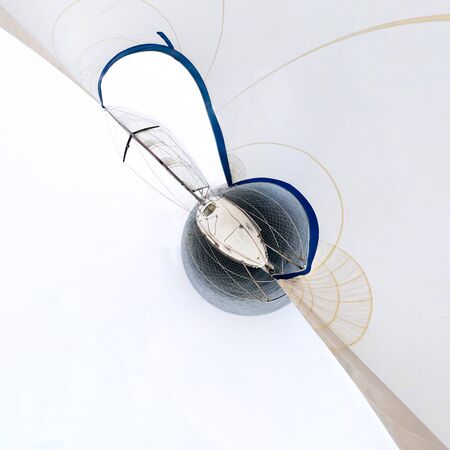 white sailing yacht sailing, view from the mast close to the sail. Tiny little planet 360.の写真素材