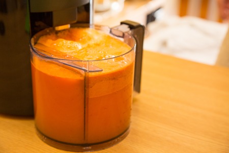 Fresh carrot juice and electrical juice extractorの写真素材