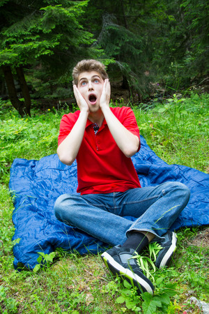 Young man with surprised faceの写真素材