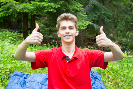 Young man showing Ok signの写真素材