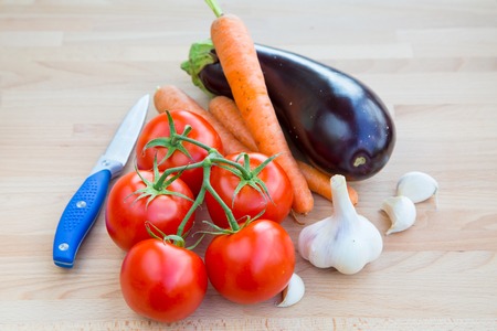 Fresh vegetables organic food set still life with eggplant, carrot, garlic and tomatoの写真素材