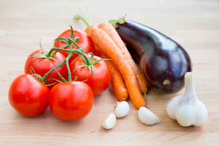 Fresh vegetables organic food set still life with eggplant, carrot, garlic and tomatoの写真素材