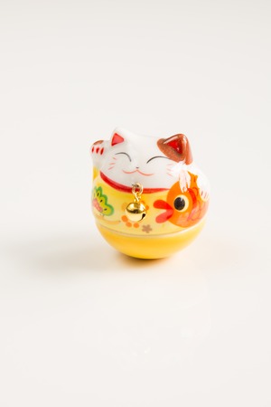 Maneki Neko  Lucky Cat isolated on White Backgroundの写真素材