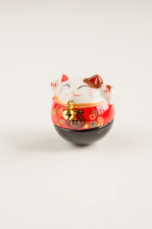 Maneki Neko  Lucky Cat isolated on White Backgroundの写真素材