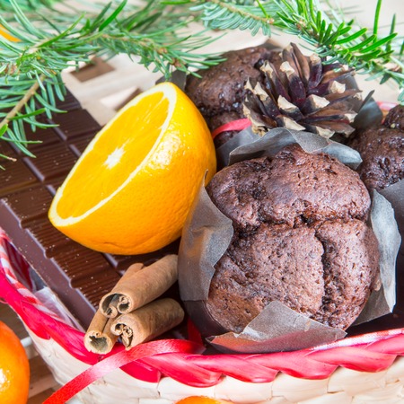 Christmas still-life with close up cupcakes, oranges and chocolateの写真素材
