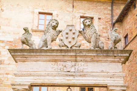 Details of ancient well of griffins and lions holding symbol of Medici family, Montepulciano, Tuscany, Italy.の写真素材