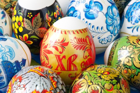 Different colors Easter eggs on the tableの写真素材