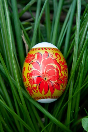 Easter egg lying in the green grass