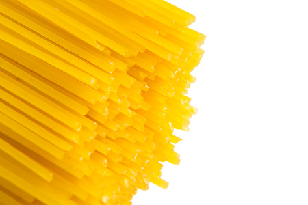 Uncooked pasta spaghetti  isolated on white backgroundの写真素材