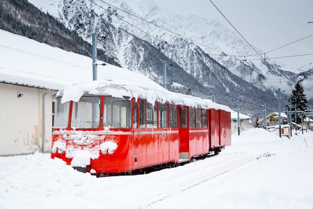 alpine red train Montenvers Mer de Glace in snowの写真素材
