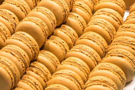 traditional french colorful macarons in a rows in the storeの写真素材