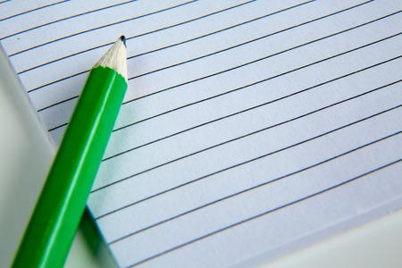 Blank notepad with pencil on the table