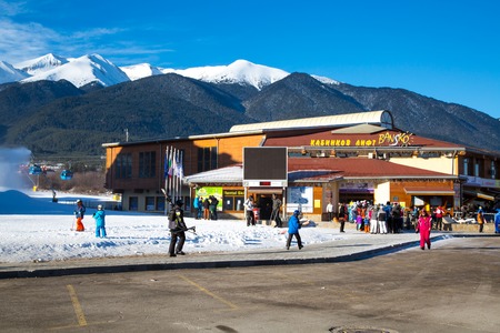 BANSKO, BULGARIA - December 2014: Bansko ski station, cable car lift and eople near it in Bansko, Bulgaria, 15 December 2014のeditorial素材