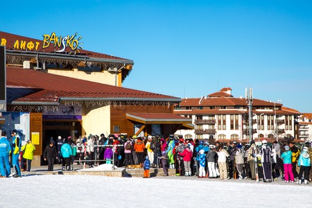 BANSKO, BULGARIA - February 2015: Bansko ski station, cable car lift and people near it in Bansko, Bulgaria, 19 February 2015のeditorial素材