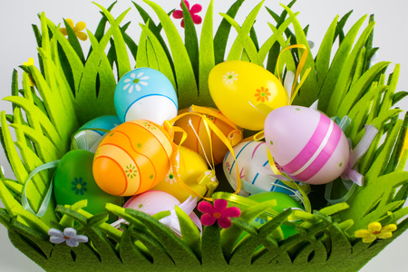 Green grass box with Easter eggs close upの写真素材