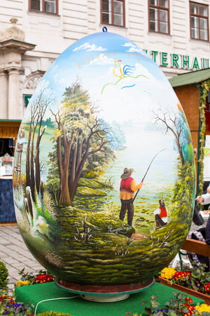 Vienna, Austia - April, 5, 2015: Colorful big painted Easter egg at Freyung traditional market in Viennaのeditorial素材