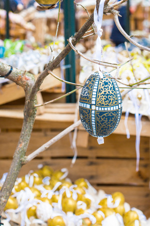 Colorful painted Easter egg on the treeの写真素材
