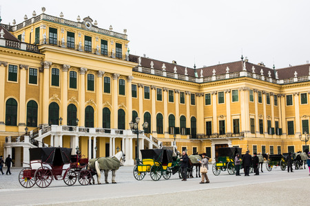 VIENNA, AUSTRIA - April 3, 2015: Several horse carriages fiaker waiting for the tourists in front of the Schonbrunn palace in Viennaのeditorial素材