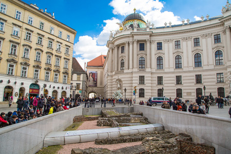Vienna, Austria - April 3, 2015: Michaelerplatz in Vienna and people looking at the medieval remains. Foundations of Roman settlement and remains of the walls of the Garden of Paradiseのeditorial素材