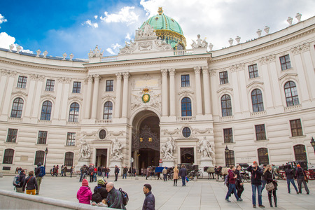 Vienna, Austria - April 3, 2015: People walking at Michaelerplatz in Vienna, Austria. Area is known by the Roman and medieval remains. The most common way to enter the Hofburgのeditorial素材