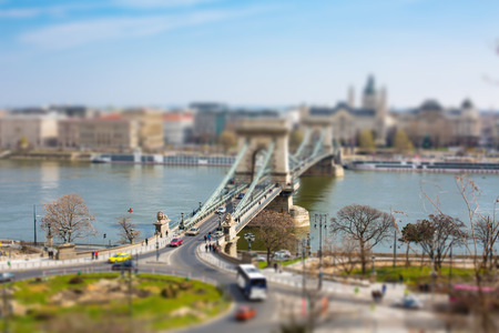 Famous Lion statues at the entrance of the Landmark of Budapest Szechenyi Chain Bridge that spans the River Danube between Buda and Pest.の写真素材