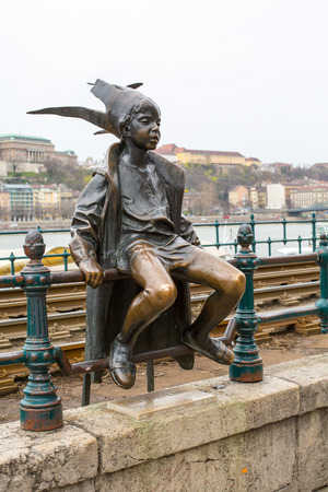 Budapest, Hungary - March 31, 2015: Statue of The little Princess Jester in Budapest Hungary, one of the symbols of Budapest, Hungary. Against Buda panoramaのeditorial素材