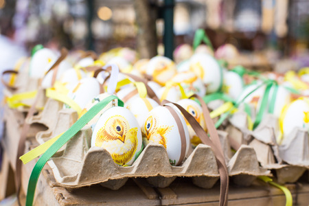 Colorful painted Easter eggs with chicken picture at the traditional marketの写真素材