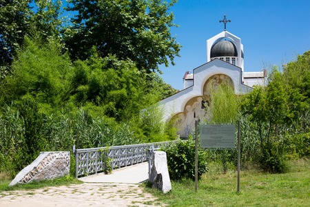Front view of St Petka of Bulgaria, Baba Vanga's church in Rupite, Bulgaria and the path to it through the bridge and green plantsの写真素材
