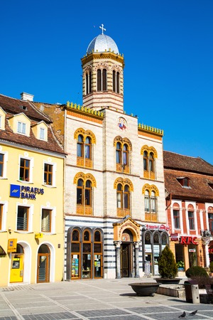 Brasov, Romania - March 24, 2015: The Orthodox Church of the Birth of the Mother of God at Council Square -Piata Sfatului - in downtown of Brasov, Romania.のeditorial素材