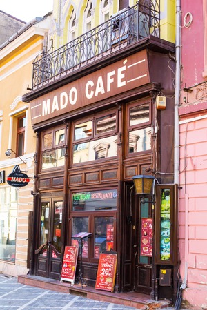 Brasov, Romania - March 24, 2015: Cafe at the pedestrian street Republicii in downtown of Brasov, Transylvania, Romania.のeditorial素材