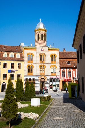 Brasov, Romania - March 24, 2015: The Orthodox Church of the Birth of the Mother of God at Council Square -Piata Sfatului - in downtown of Brasov, Romania.のeditorial素材
