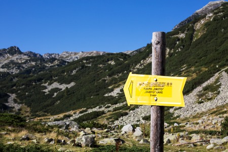 Bansko, Bulgaria - September, 5, 2015:  Signpost to Okoto lake touristic route near Bansko, Bulgaria on mountain backgroundのeditorial素材
