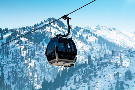 Almaty, Kazakhstan - March, 2, 2014:  Ski lift, Gondola lift, cable car at Medeo to Shymbulak route near Almaty against mountain backgroundのeditorial素材