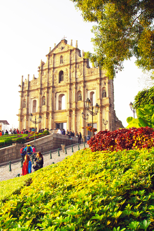 Macau, Macau- January, 10, 2014: The facade of Saint Paul's Cathedral in Macau. People walking and taking photos around itのeditorial素材