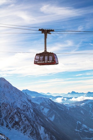 Chamonix, France - January 28, 2015: Cable Car from Chamonix to the summit of the Aiguille du Midi  and mountains panorama Chamonix, France.のeditorial素材