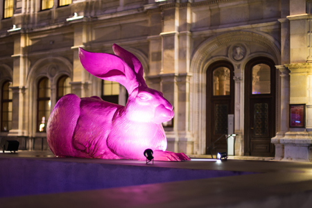 Big Illuminated Pink Easter rabbit  figurine at the street of Viennaの写真素材