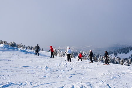 Kopaonik, Serbia - January 22, 2016: Ski resort Kopaonik, Serbia, ski slope, people skiing down the hill, mountains view, fogのeditorial素材