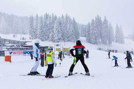Kopaonik, Serbia - January 18, 2016: Panorama of ski resort Kopaonik during snowfall, people, skiers, snowy trees at winter timeのeditorial素材