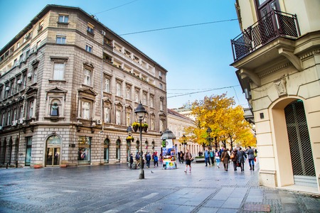 Belgrade, Serbia - November 2, 2014: The old street Skadarlija in Belgrade, people, yellow autumn treesのeditorial素材