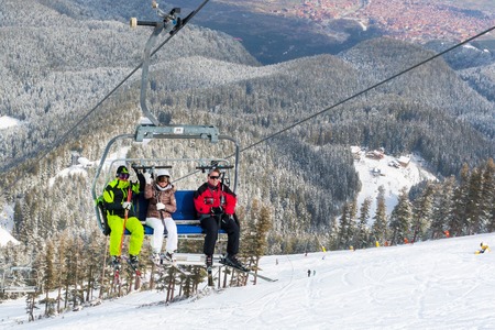 Bansko, Bulgaria - March 4, 2016: Ski resort Bansko, Bulgaria aerial view, skiers on lift,  people skiing on slopesのeditorial素材