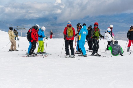 Bansko, Bulgaria - March 4, 2016: Ski resort, skiers at the high lift station, Bansko, Bulgariaのeditorial素材