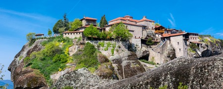 Panorama of Great Meteoro Monastery, Meteora rocks and tourists walking around