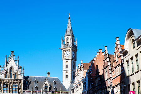 Details of old Post Office building with the clock tower against blue sky in Ghent, Belgiumのeditorial素材